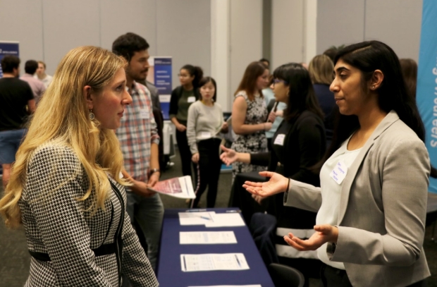 Promidian Consulting Renu Kondragunta talking with a Stanford trainee at BBIE 2019